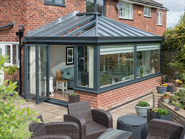 Solid roof conservatory with anthracite grey frames